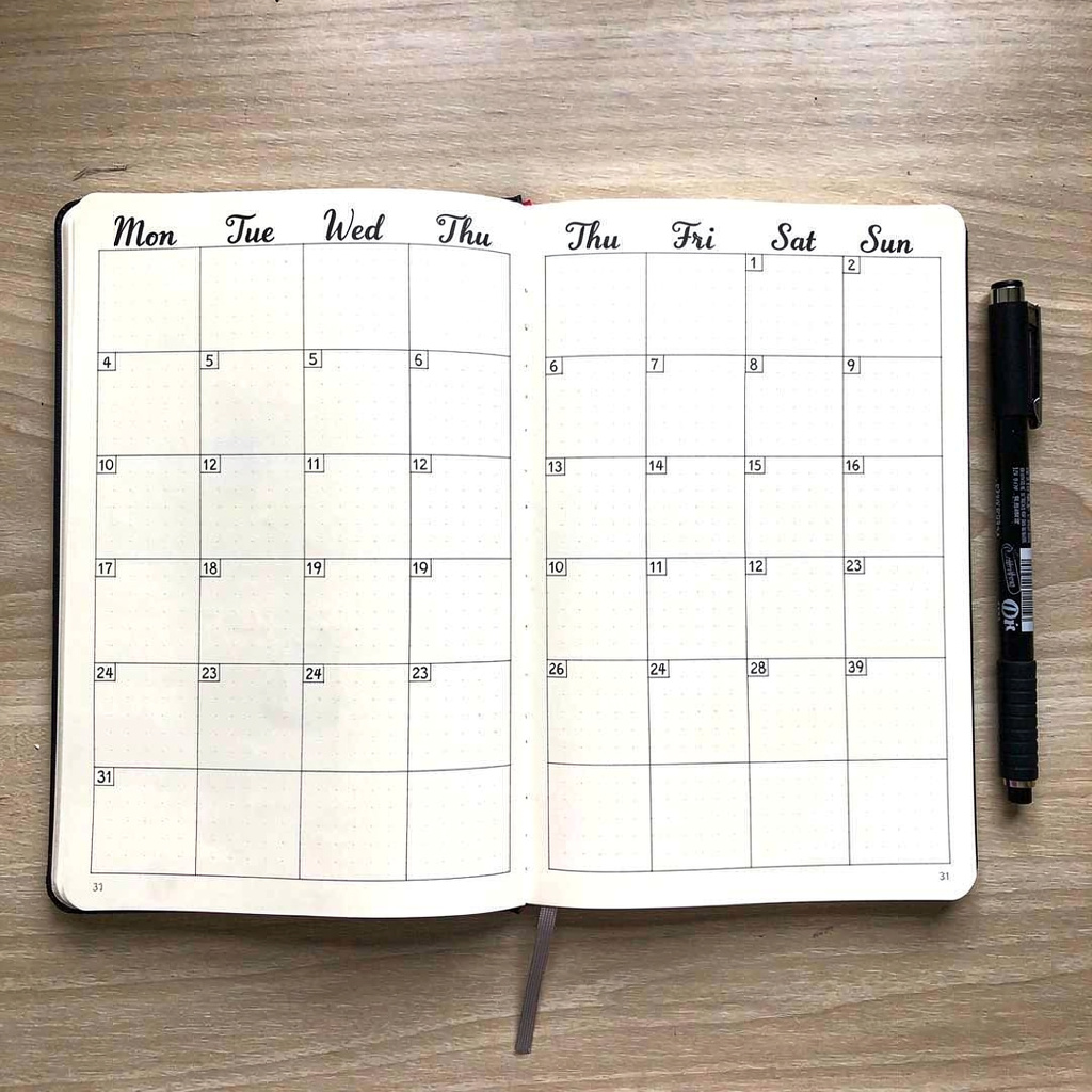 Monthly calendar grid layout in bullet journal